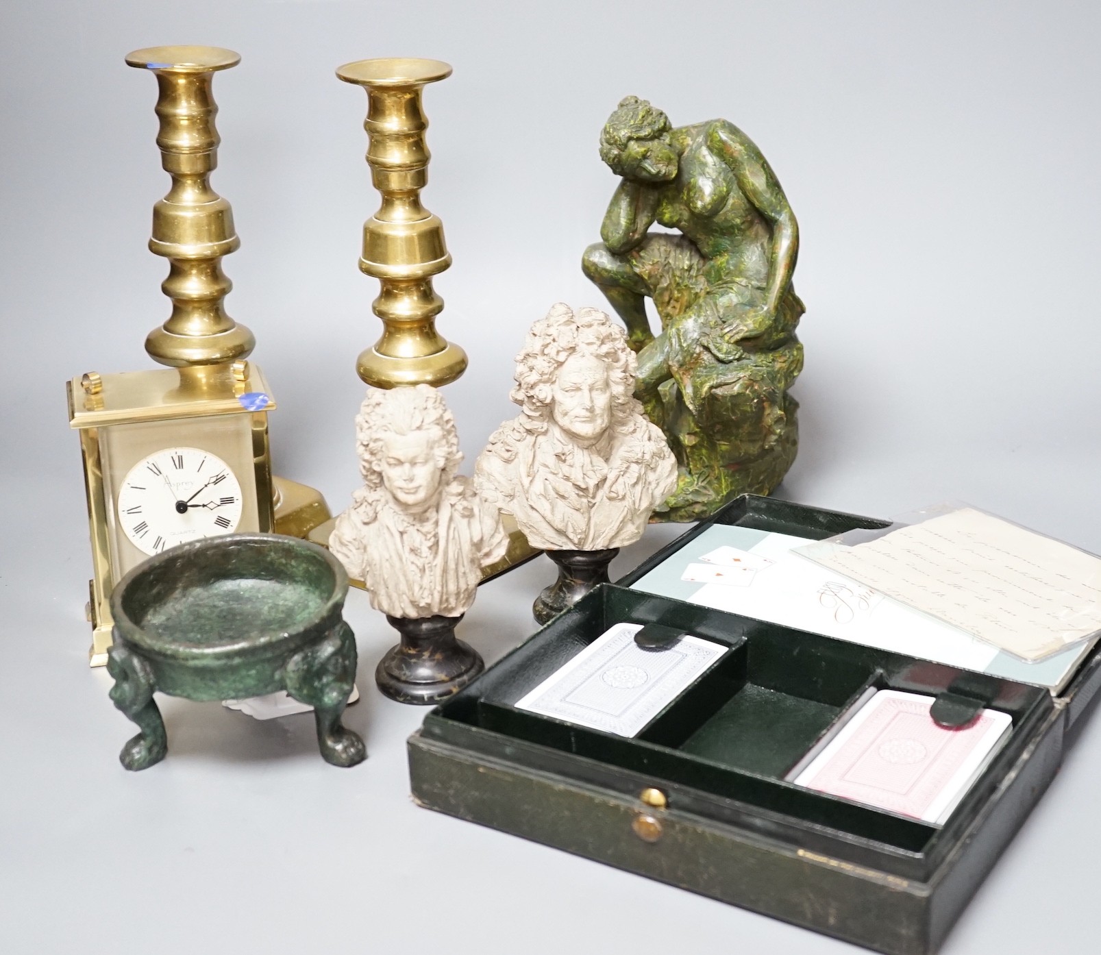 A pair of small terracotta busts after Chinard, a glazed pottery figure, a pair of Victorian brass candlesticks, Asprey retailed timepiece etc. tallest 25cm